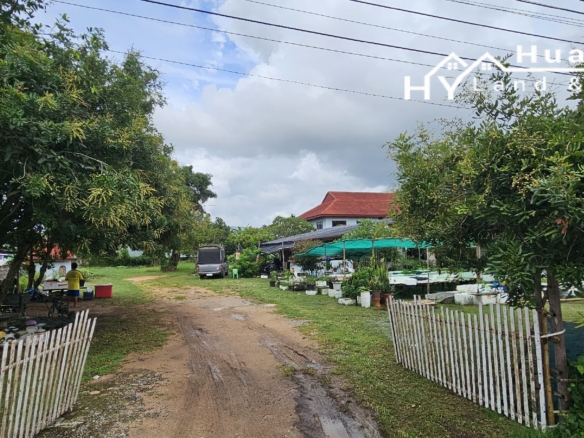 #3494        6+ rai large Thai House + 2nd house on main road.  Excellent Value