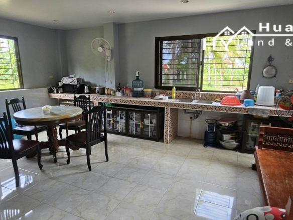 #3494        6+ rai large Thai House + 2nd house on main road.  Excellent Value